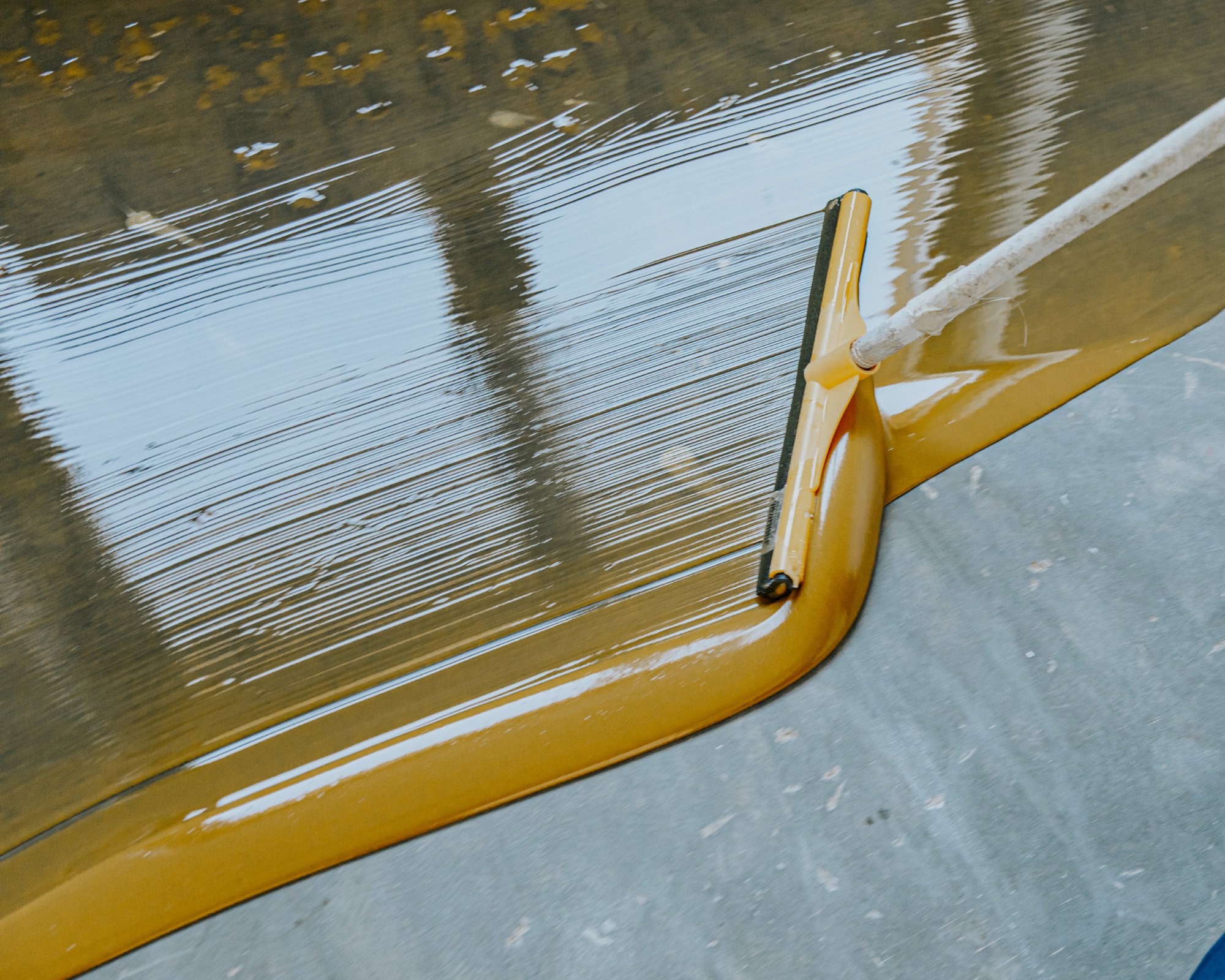 spreading-epoxy; epoxy patio